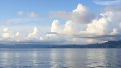 Clouds and lake waters merge in a peaceful scene, calm, peaceful atmosphere, tranquility