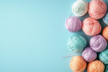A collection of colorful yarn balls arranged on blue background