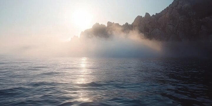 Fog rolling in over a quiet sea, mystical and cinematic