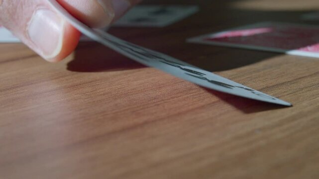 Hand turning card, slow motion
