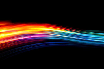 Vertical Colorful abstract light trail on black background.