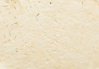 Overhead view of crackers dough on parchment paper, cracker biscuit dough on white background,...