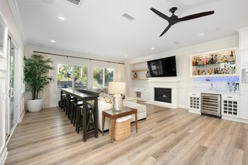 Bright and elegant open-concept living space with a modern furnishing in a luxury home