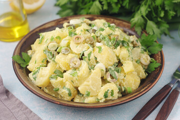 A bowl with Greek potato salads	