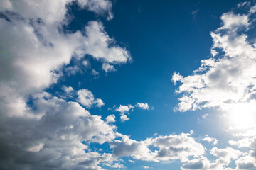 Fototapeta premium Partly cloudy sky background with sun