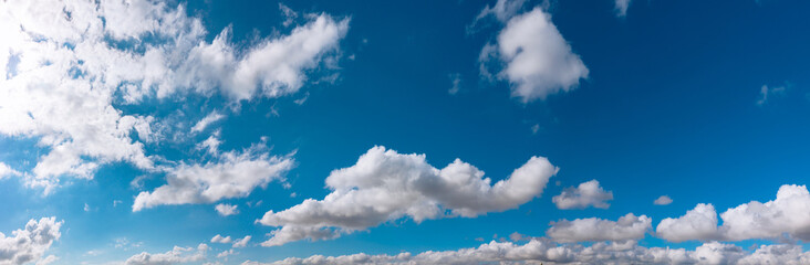 Panoramic view of partly cloudy sky. Cloudscape banner with panoramic view