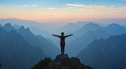 silhouette of a women on the top of the mountain