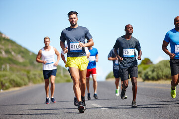 Sports, men and running marathon in road for race challenge, long distance pace and endurance....