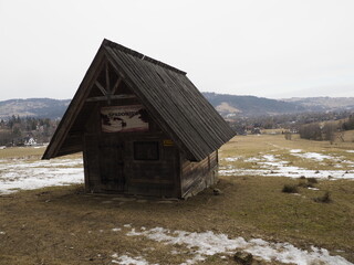 Wooden Hut in Mountain Landscape
