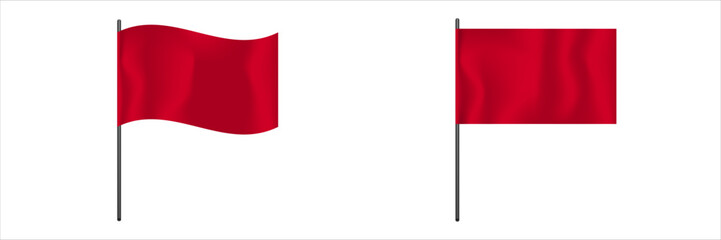One red flag waves in the wind while the other flag remains still on its pole.