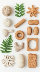 A collection of textured, neutral-colored decorative elements, including leaves and various shapes, arranged aesthetically on a light background.