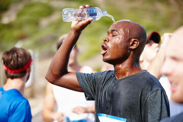 Break, runner and man pouring water for marathon, competition rest and workout fatigue. Athlete, tournament and sports male person in nature, outdoor exercise and tired race with refreshing liquid