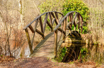 Nieuwkoop, The Netherlands, February 26, 2025: small wooden archbridgeacross a ditch as part of a...