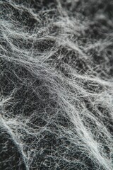Fototapeta premium Vertical Close-Up View of a Gray Felt Fabric Texture Showing Detailed Fibers.