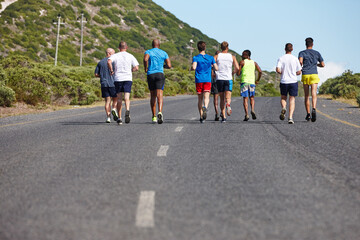 Obraz premium Group, fitness and back with running in road for marathon competition, endurance training and workout. People, performance and exercise for race, sports challenge and long distance pace for athletes