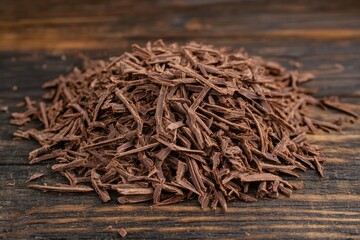 Brown Wood Chips Pile on Dark Wooden Surface for Natural Decor