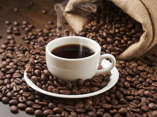 Fototapeta premium A cup of steaming black coffee surrounded by roasted coffee beans.