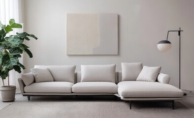 Fototapeta premium Modern light beige sectional sofa in a minimalist living room with abstract art and floor lamp.