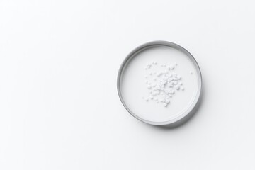 single petri dish with bacterial colonies on white background