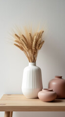 creamy white vase with wheat stalks and dusty rose vases