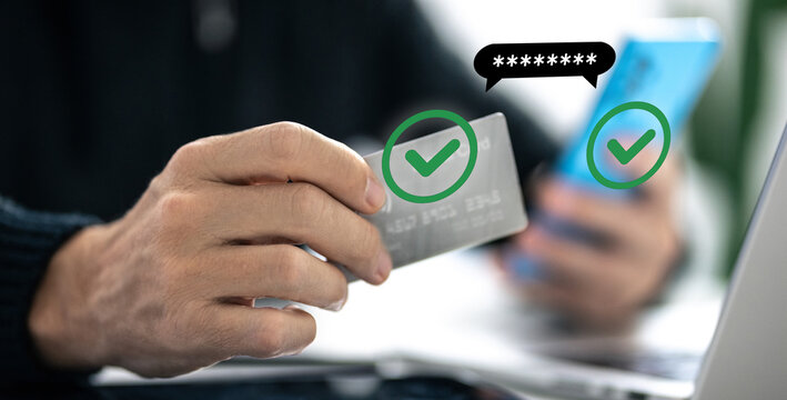 Man using credit card, paying via mobile banking app. 2FA payment, two factor authentication concept