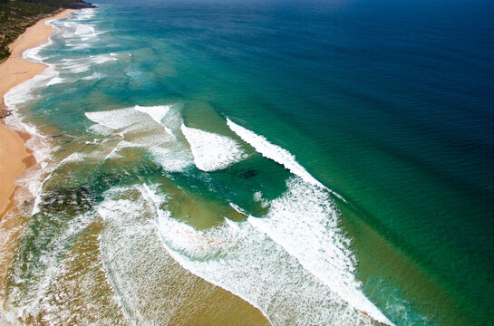 aerial view of waves coming into shore
