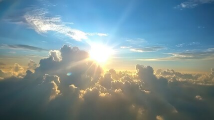 Sun shining through fluffy clouds above.