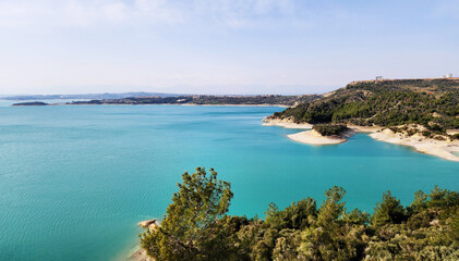 Naklejka premium Seyhan Dam Lake, located north of Adana city, offers a relaxing weekend trip with its unique turquoise appearance