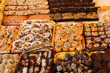 An assortment of pastries and oriental sweets at the market square during traditional festivals.