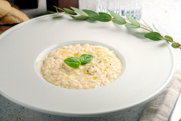 Creamy risotto 4 cheeses with parmesan, gorgonzola, brie and camembert. A dish with rice and cheese