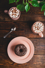 Stack of Chocolate Donuts and Hot Chocolate with Marshmallow