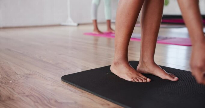 Pilates, mat and start with feet of woman in class for hot yoga studio, exercise and sweating. Bikram workout, health and closeup of legs of person on floor of gym for fitness, wellness and balance