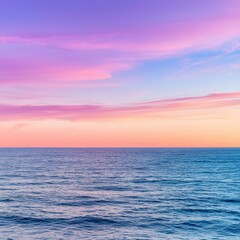 Fototapeta premium Breathtaking sunset over the ocean casting vibrant colors across the sky and reflecting on the calm water's surface