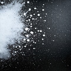 Close-up of a pile of granulated sugar on a dark surface with fine texture highlighting its sweetness and purity