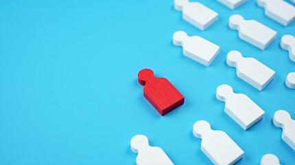 Obraz premium Individuality in Focus: A vibrant red figure stands out against a sea of white, symbolizing uniqueness and standing apart from the crowd on a bright blue backdrop