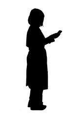 silhouette of a side view of standing woman looking at her smartphone