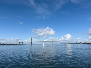 The Arthur Ravenel Jr Bridge spanning across Charleston Bay in South Carolina with sailboats