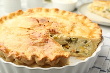 Tasty homemade pie with chicken and vegetables on table, closeup