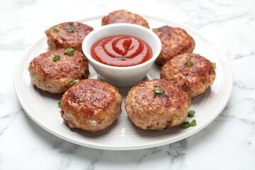 Delicious patties served on white table, closeup