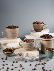 Fresh coffee beans in a mug and background.