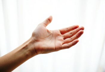 Obraz premium An open hand reaching out against a soft, blurred background