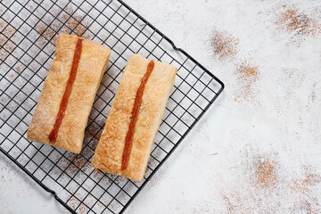 Homemade nut shaped russian soviet cookies and wafer rolls with pastry cream.