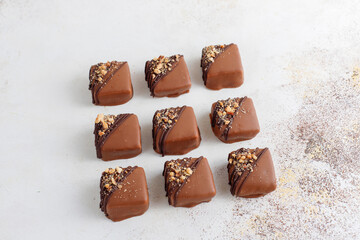Handmade chocolate with pistachios, dark and milk chocolate pieces.