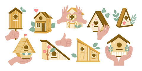Birdhouses. Hands hold birdhouses