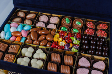 Handmade chocolate with pistachios, dark and milk chocolate pieces.