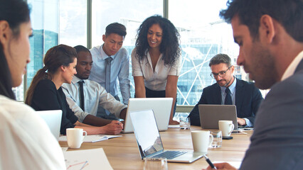 Business Team Around Table In Modern Office Collaborating Together