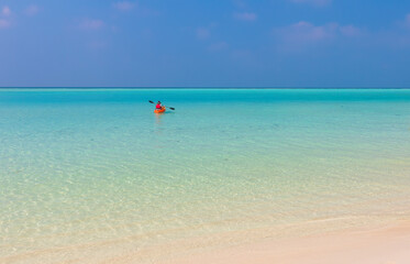 Man sailing on a boat in the lagoon