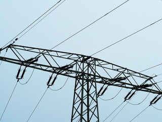 high-voltage mast with powerlines supplies households with energy – a modern, robust system...