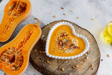 Traditional autumn butternut squash soup with seeds.