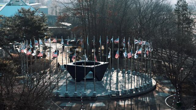 Numerous US and South Korean flags near the DMZ, symbolizing the strong alliance, shared commitment to security, and ongoing efforts for peace on the Korean Peninsula
